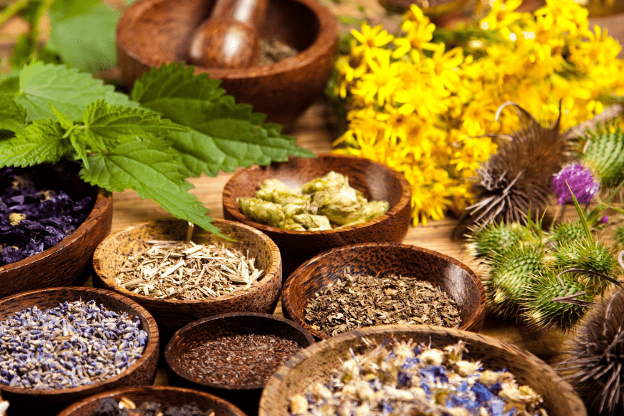 anti-inflammatory herbs and spices in wood bowls