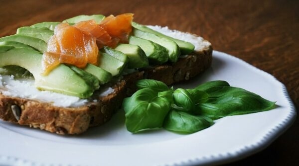 omega-3 fatty acid in salmon on avocado on whole grain bread