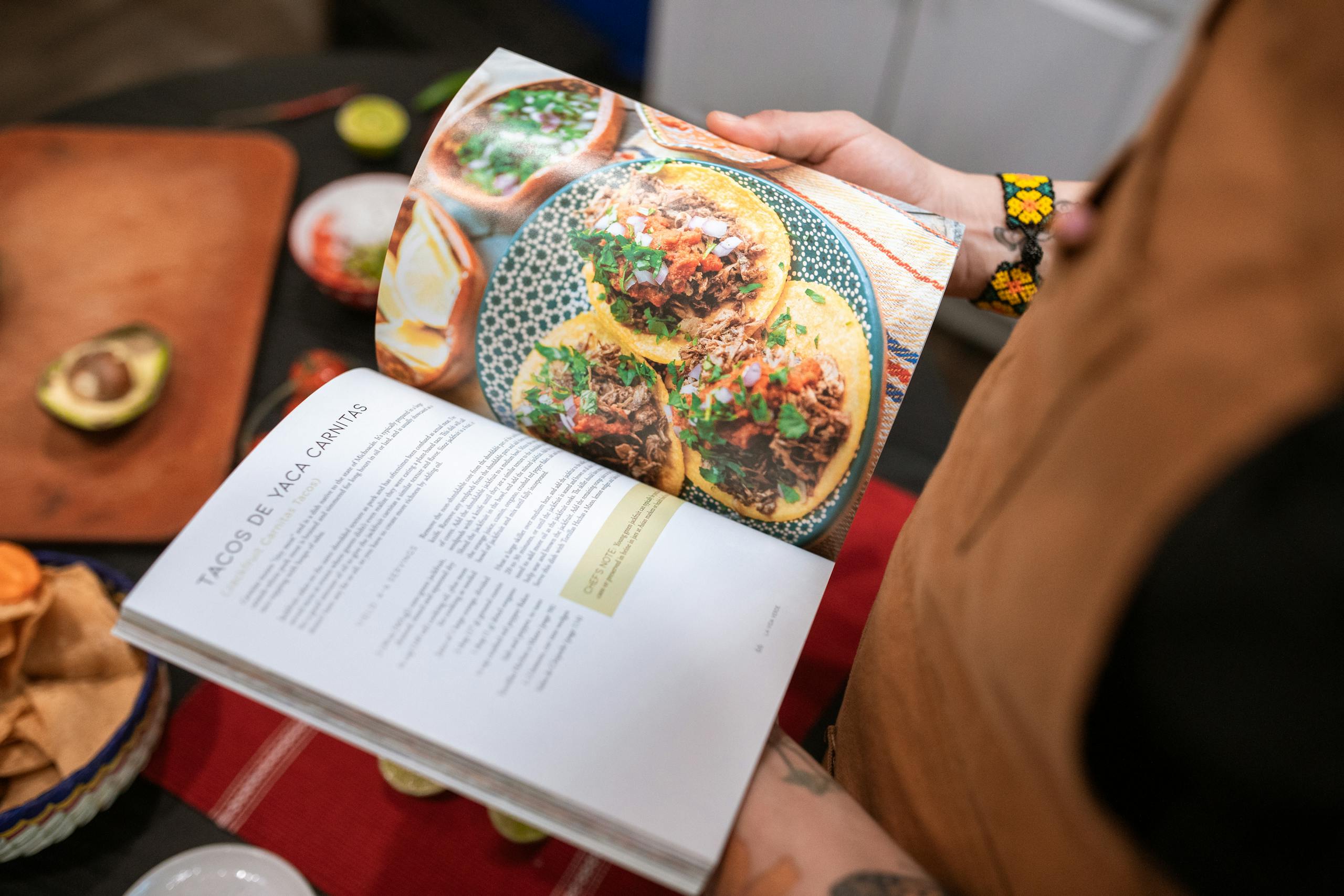herb-infused recipes A Person Reading a Cookbook