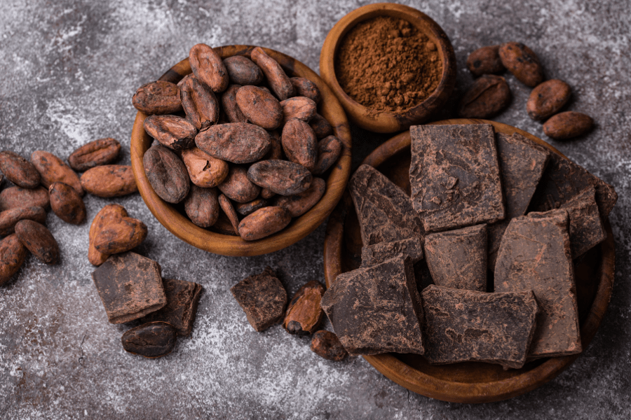 cocoa powder, cocoa beans and chunks of bitter chocolate