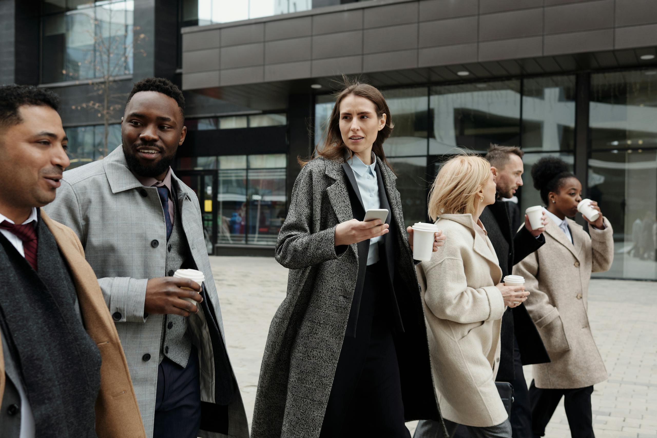Coffee Break for productivity: Coworkers Taking a coffee break and a walk